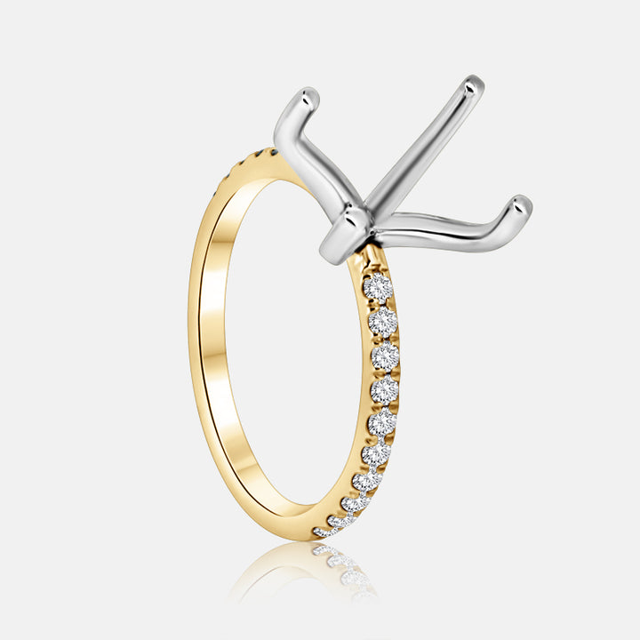 Yellow gold engagement ring with pave diamonds.