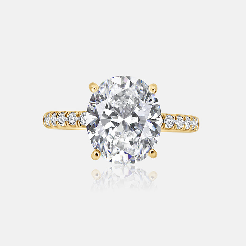 Solitaire Engagement Ring with .30 carats of pave round diamond in 14 Karat Yellow Gold