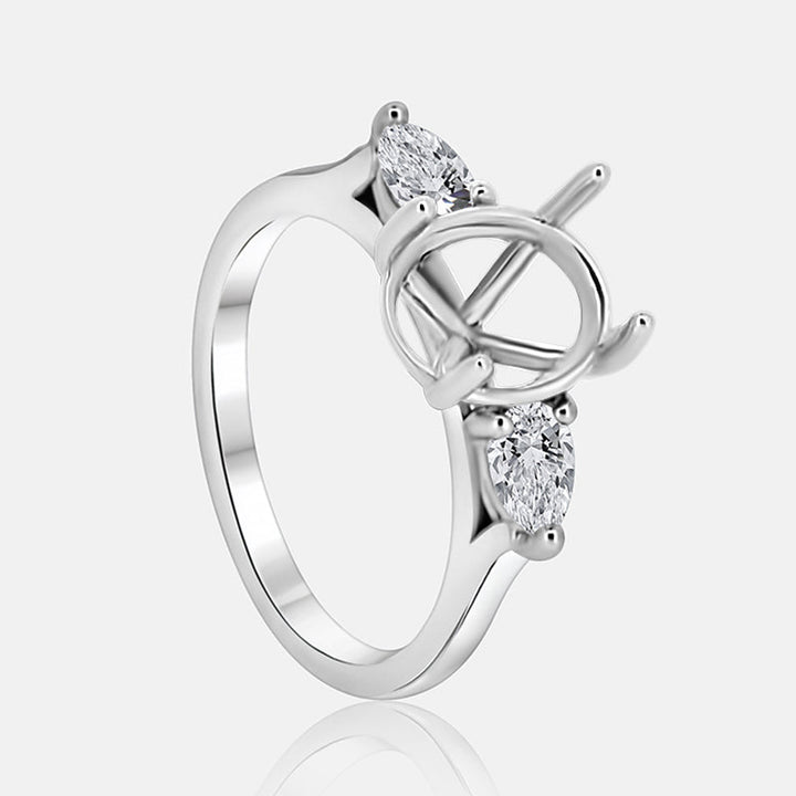 Three stone Engagement Ring with .52 carats of pear shape diamonds in 14 karat white gold