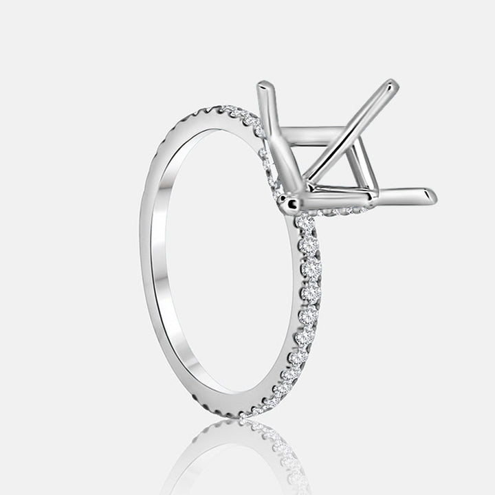 Solitaire Hidden Halo Engagement Ring with .50 carats of pave diamonds in 14 Karat White Gold