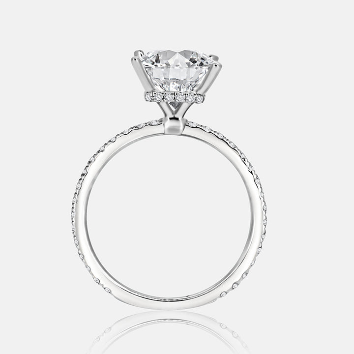 Solitaire Hidden Halo Engagement Ring with .50 carats of pave diamonds in 14 Karat White Gold