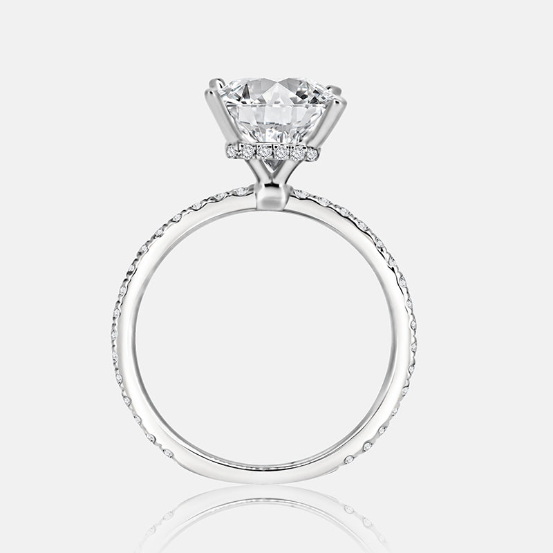 Solitaire Hidden Halo Engagement Ring with .50 carats of pave diamonds in 14 Karat White Gold