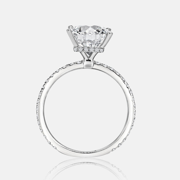 Solitaire Hidden Halo Engagement Ring with .50 carats of pave diamonds in 14 Karat White Gold