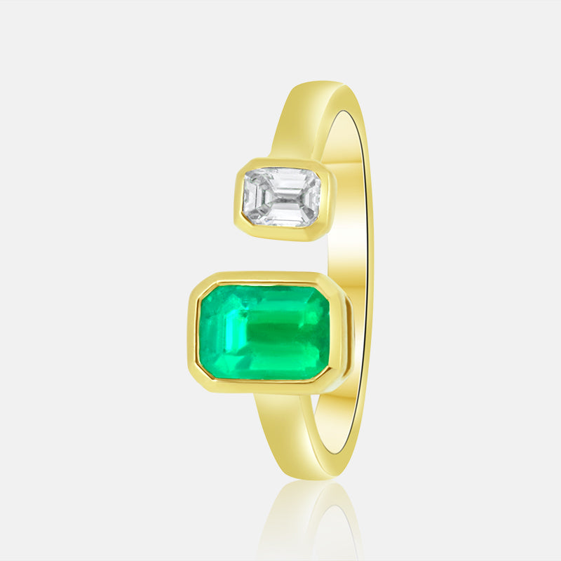 14k Yellow Gold Double Bezel set ladies band with a 1.14ct Emerald and a .21ct Emerald Cut Diamond