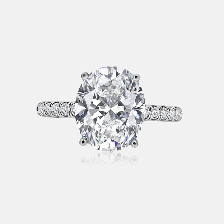 Solitaire Engagement Ring with .30 carats of pave round diamonds in 14 Karat White Gold
