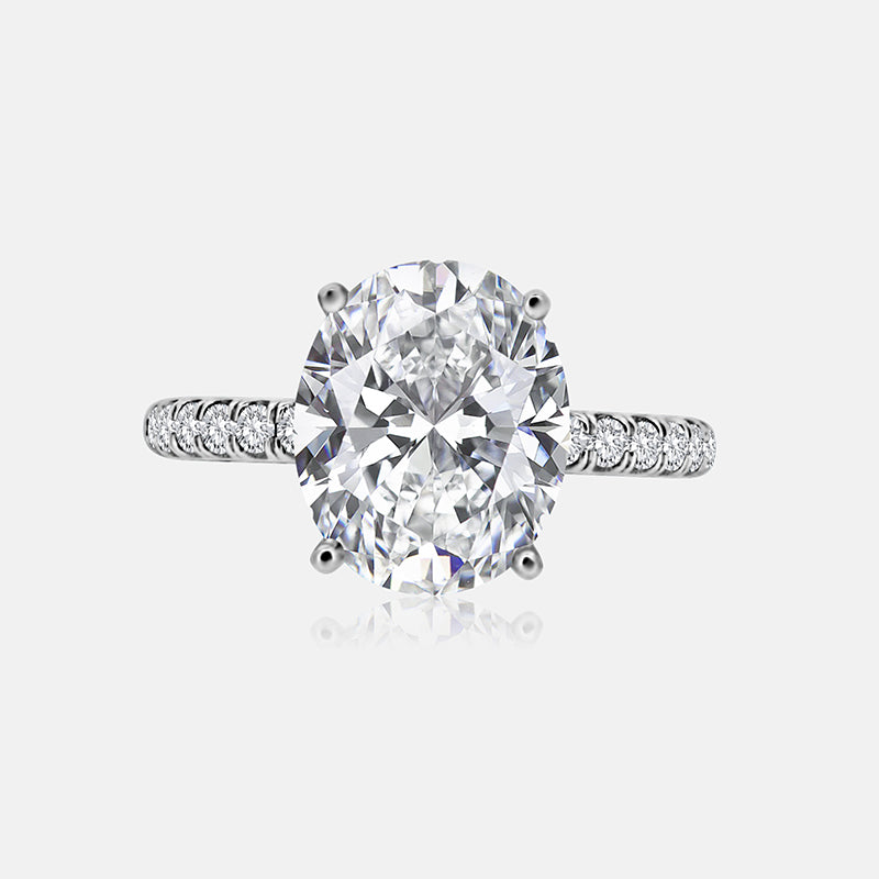 Solitaire Engagement Ring with .30 carats of pave round diamonds in 14 Karat White Gold