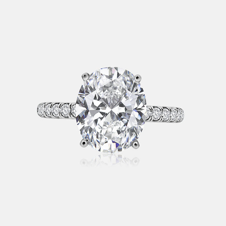 Solitaire Engagement Ring with .30 carats of pave round diamonds in 14 Karat White Gold