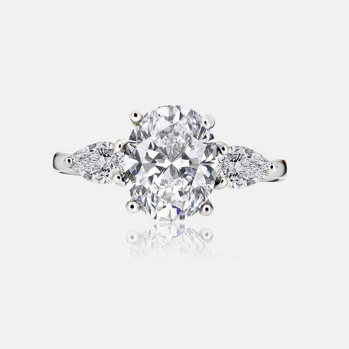 Three stone Engagement Ring with .52 carats of pear shape diamonds in 14 karat white gold