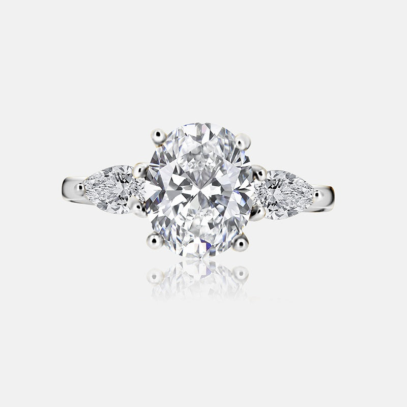 Three stone Engagement Ring with .52 carats of pear shape diamonds in 14 karat white gold