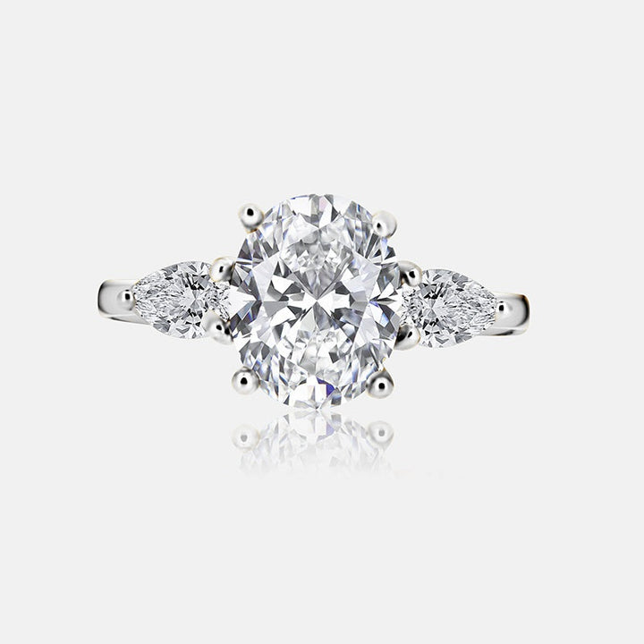 Three stone Engagement Ring with .52 carats of pear shape diamonds in 14 karat white gold