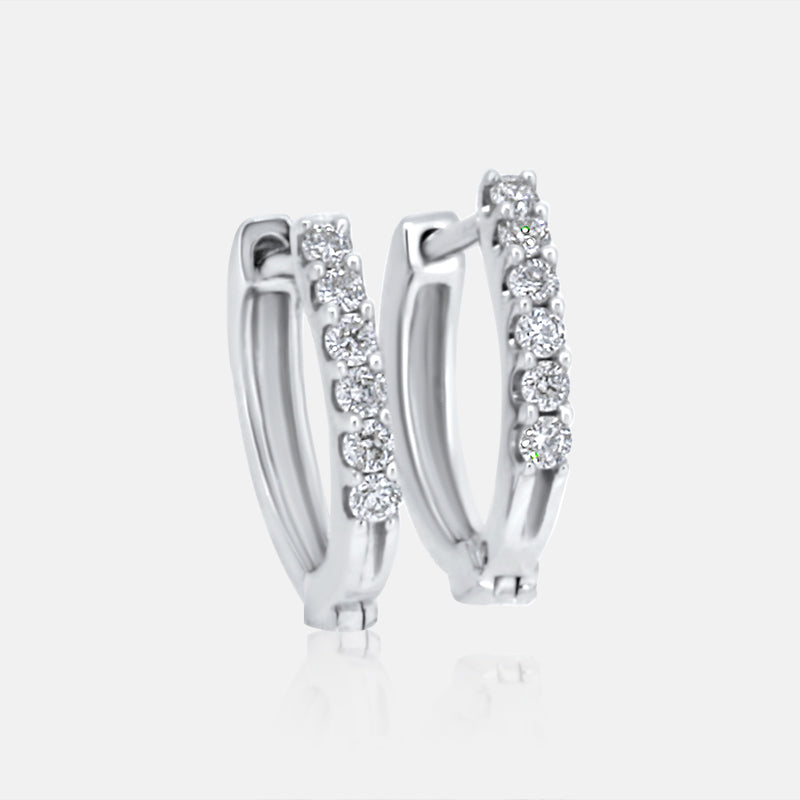 Delicate Diamond Huggie Earrings in 10K White Gold with .10 carat of Diamonds