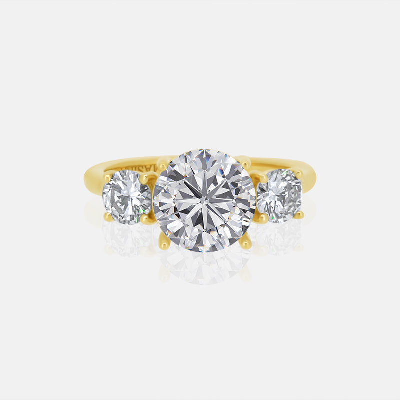 Three Stone with Round Side Stones Mounting in 14k yellow gold with.90 carats of diamonds