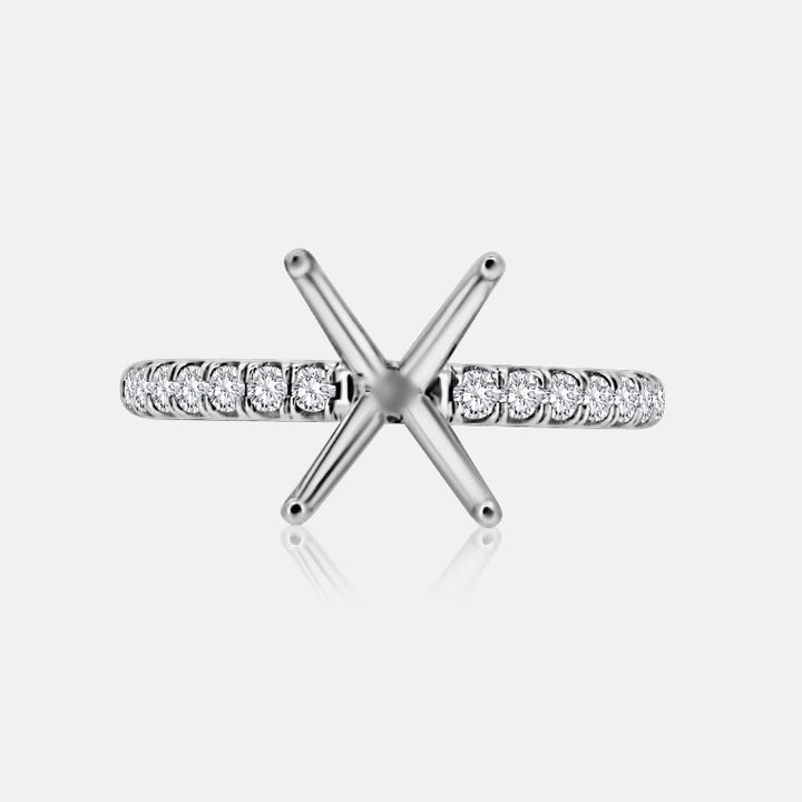 Solitaire Engagement Ring with .30 carats of pave round diamonds in 14 Karat White Gold