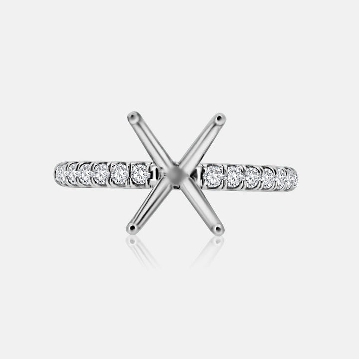 Solitaire Engagement Ring with .30 carats of pave round diamonds in 14 Karat White Gold