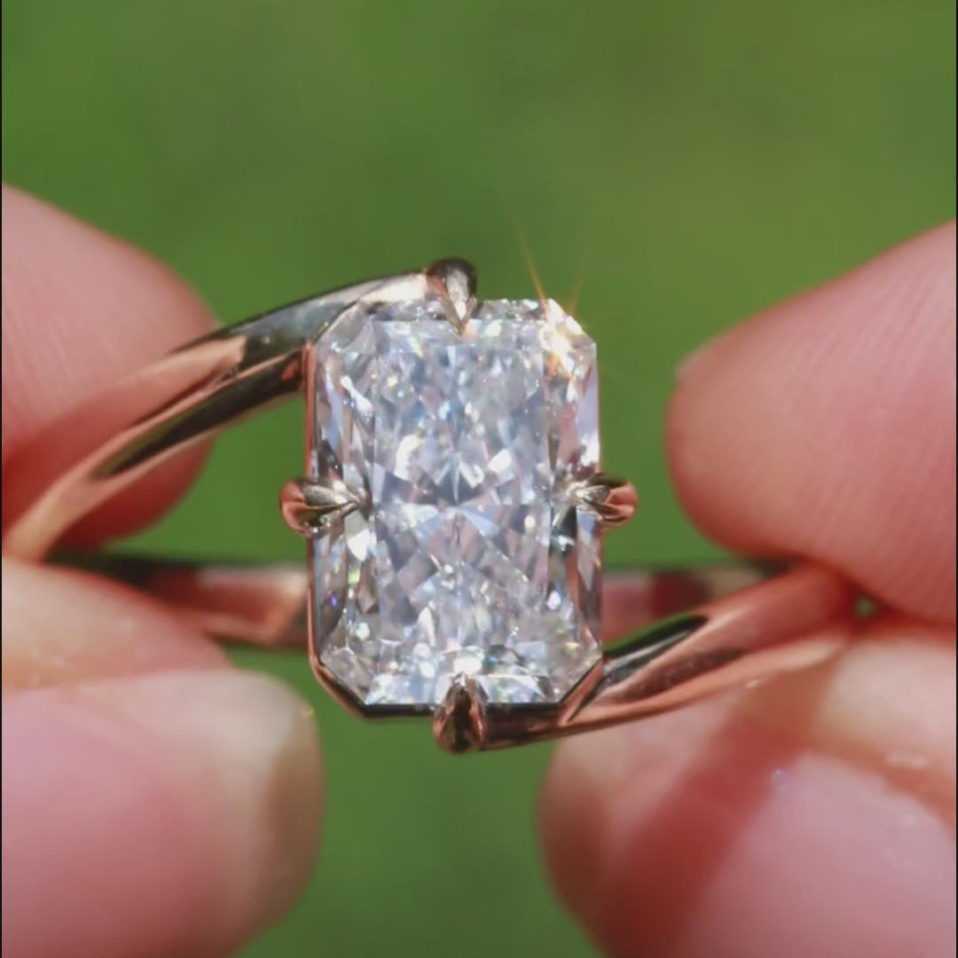 Overlap Yellow Gold Radiant cut engagement ring with compass prongs 