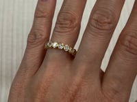 Modern Bezel Set Oval Diamond Ring in 14 Karat Yellow Gold with 0.90 Carat of Diamonds