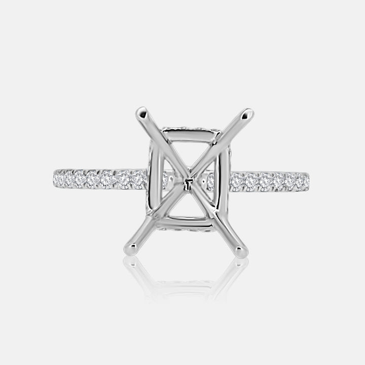 Solitaire Hidden Halo Engagement Ring with .50 carats of pave diamonds in 14 Karat White Gold