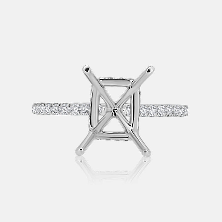 Solitaire Hidden Halo Engagement Ring with .50 carats of pave diamonds in 14 Karat White Gold
