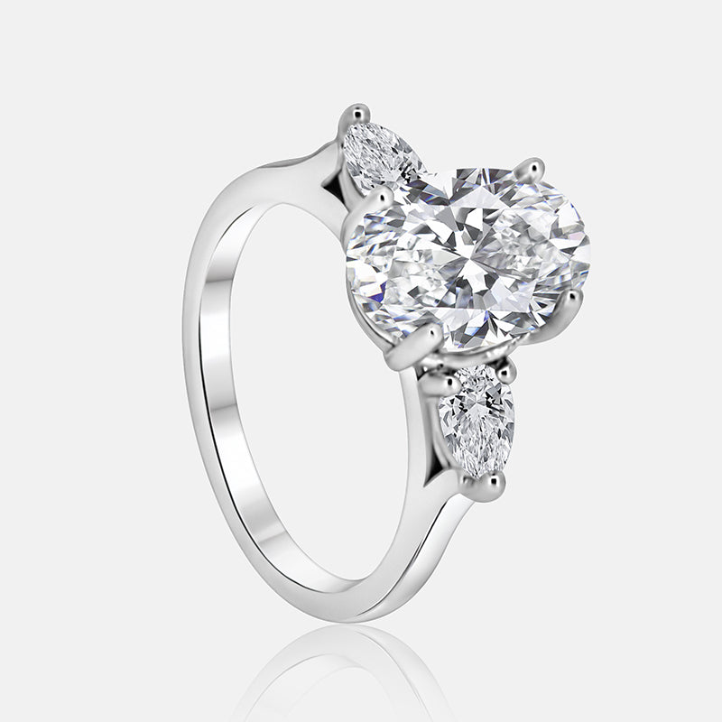 Three stone Engagement Ring with .52 carats of pear shape diamonds in 14 karat white gold