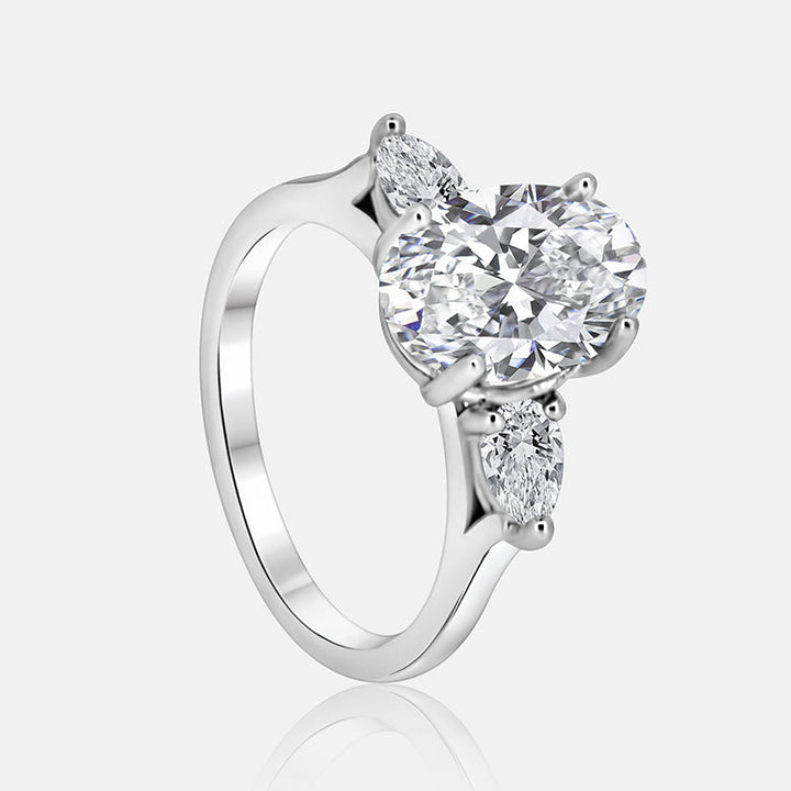Three stone Engagement Ring with .52 carats of pear shape diamonds in 14 karat white gold
