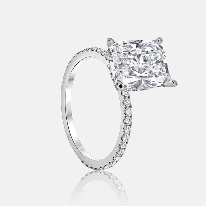 Solitaire Hidden Halo Engagement Ring with .50 carats of pave diamonds in 14 Karat White Gold