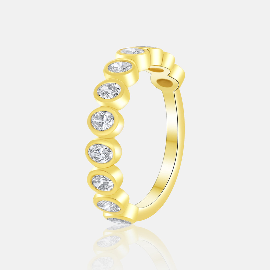 Modern Bezel Set Oval Diamond Ring in 14 Karat Yellow Gold with 0.90 Carat of Diamonds