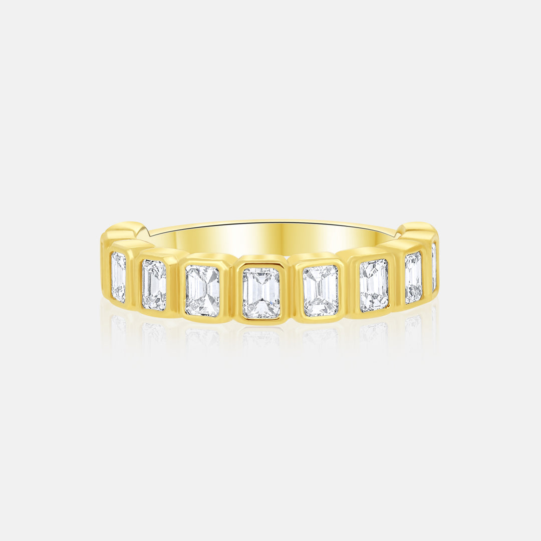 Modern Bezel Set Emerald Cut Diamond Ring in 14 Karat Yellow Gold with 1.30 Carat of Diamonds