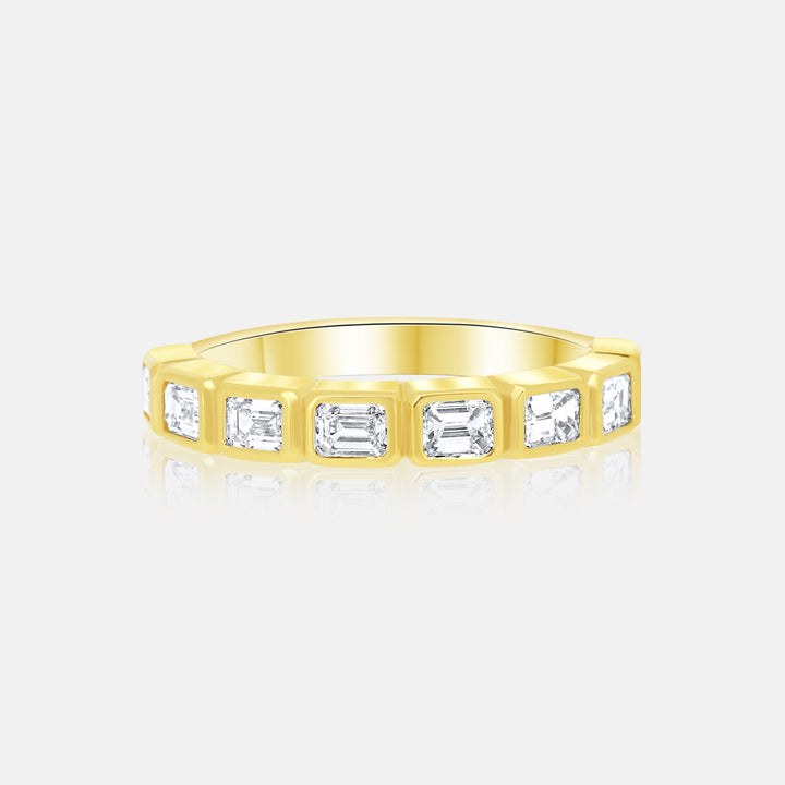 Modern Horizontal Bezel Set Emerald Cut Diamond Ring in 14 Karat Yellow Gold with .95 Carat of Diamonds