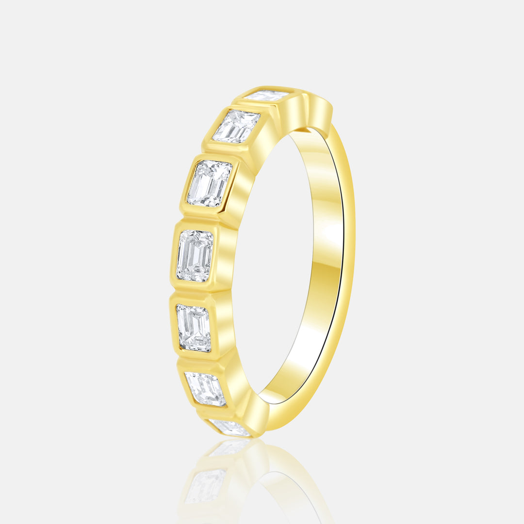 Modern Horizontal Bezel Set Emerald Cut Diamond Ring in 14 Karat Yellow Gold with .95 Carat of Diamonds