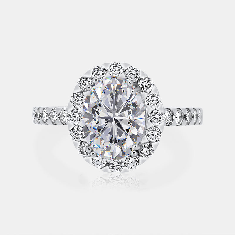 Oval Halo Engagement Ring with .79 carat of Diamonds in 18 Karat White Gold