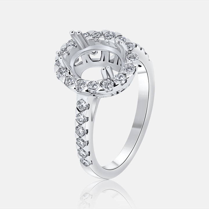Oval Halo Engagement Ring with .79 carat of Diamonds in 18 Karat White Gold