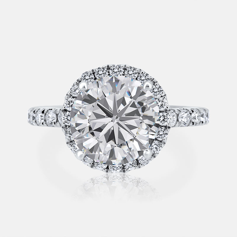 Round Halo Engagement Ring with .91 carats in 18 Karat White Gold