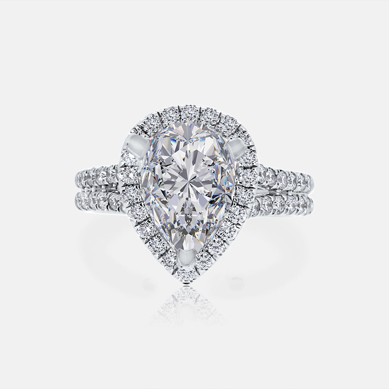 Pear Shape Halo Engagement Ring Split Shank with .71 carat of Diamonds in 18 Karat White Gold