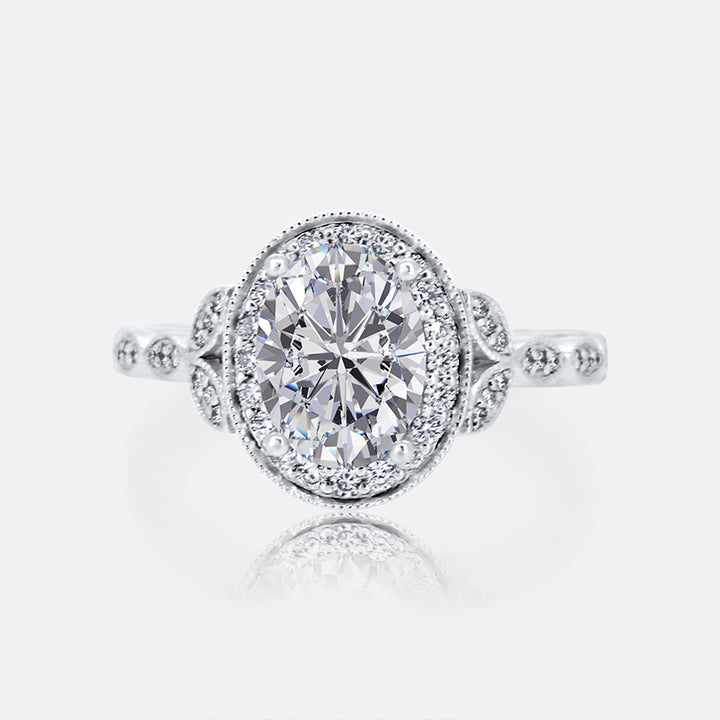 Vintage Inspired Oval Halo Engagement Ring with .28 carat of diamonds in 18 Karat White Gold