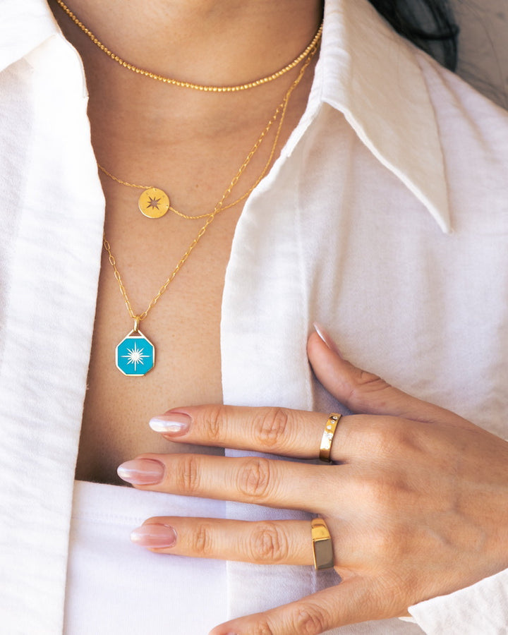 Blue Medallion Necklace in 14 Karat Yellow Gold with .01 carat of Diamonds